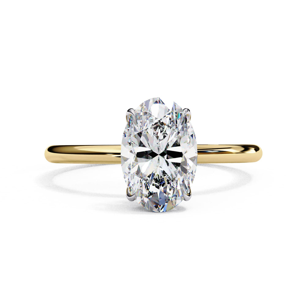 Gold ring with a large diamond on a white background