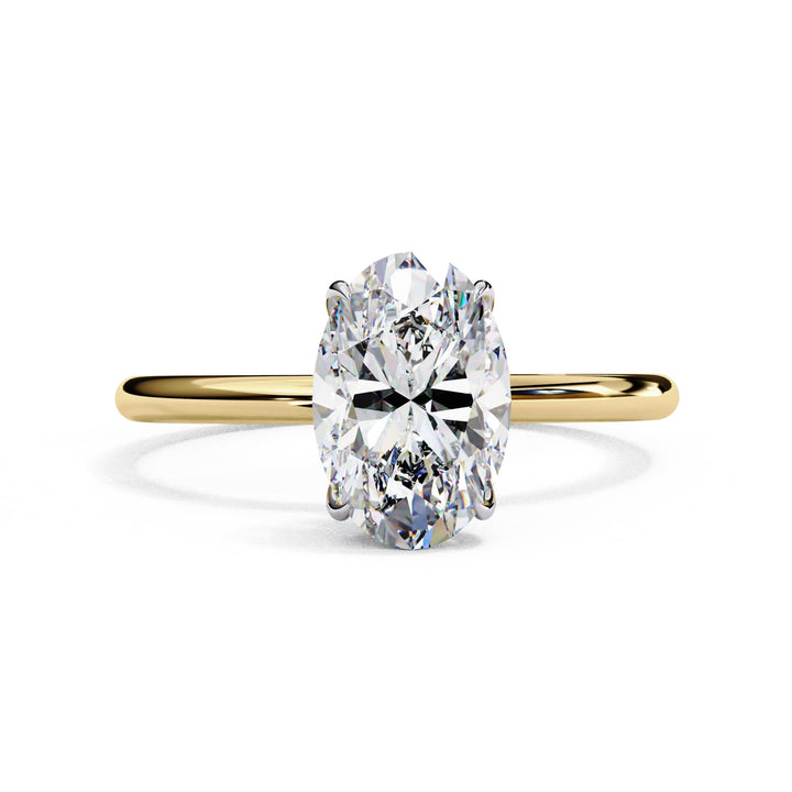 Gold ring with a large diamond on a white background