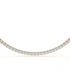 Gold necklace with diamonds on a white background