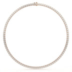 Rose gold necklace with diamonds on a white background
