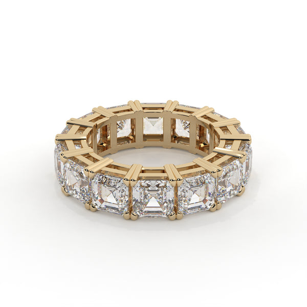 Gold ring with diamond accents on a white background