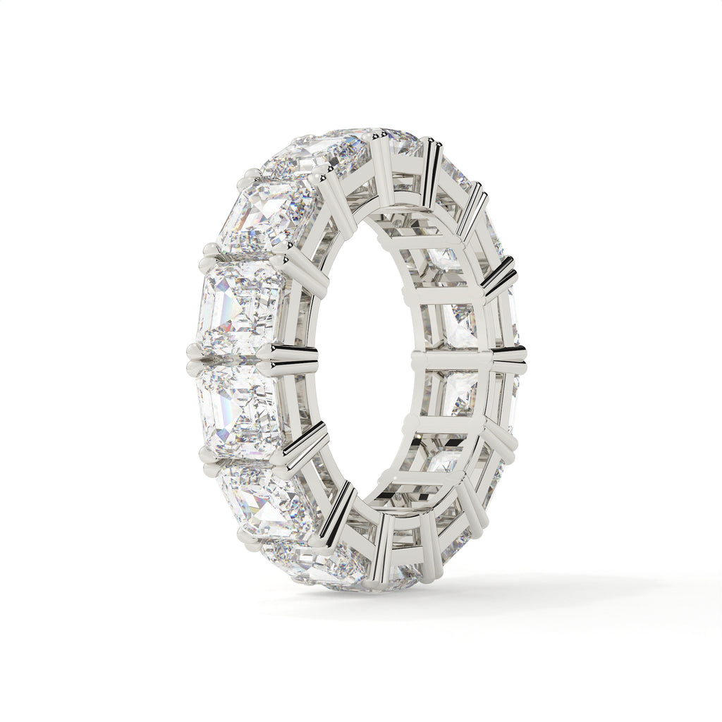 Silver ring with multiple diamonds on a white background