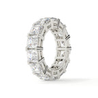 Silver ring with multiple diamonds on a white background