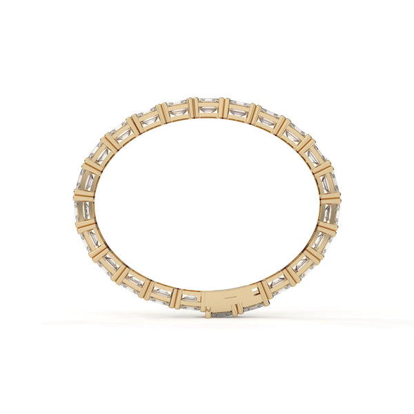 Gold ring with embedded diamonds on a white background