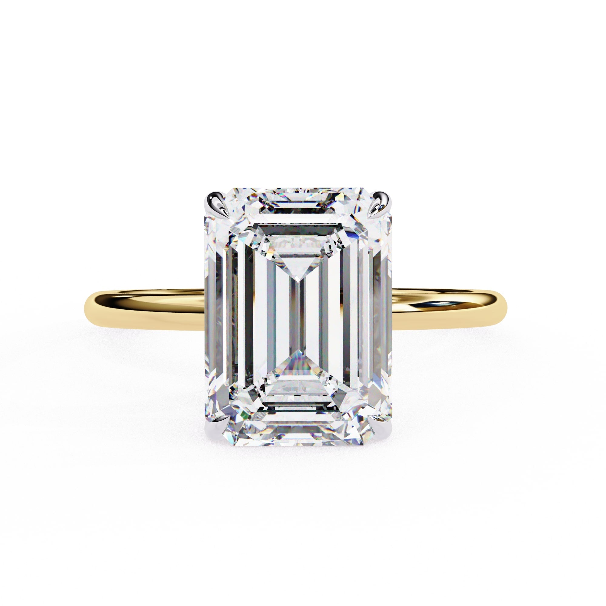 Gold ring with a large emerald-cut diamond on a white background