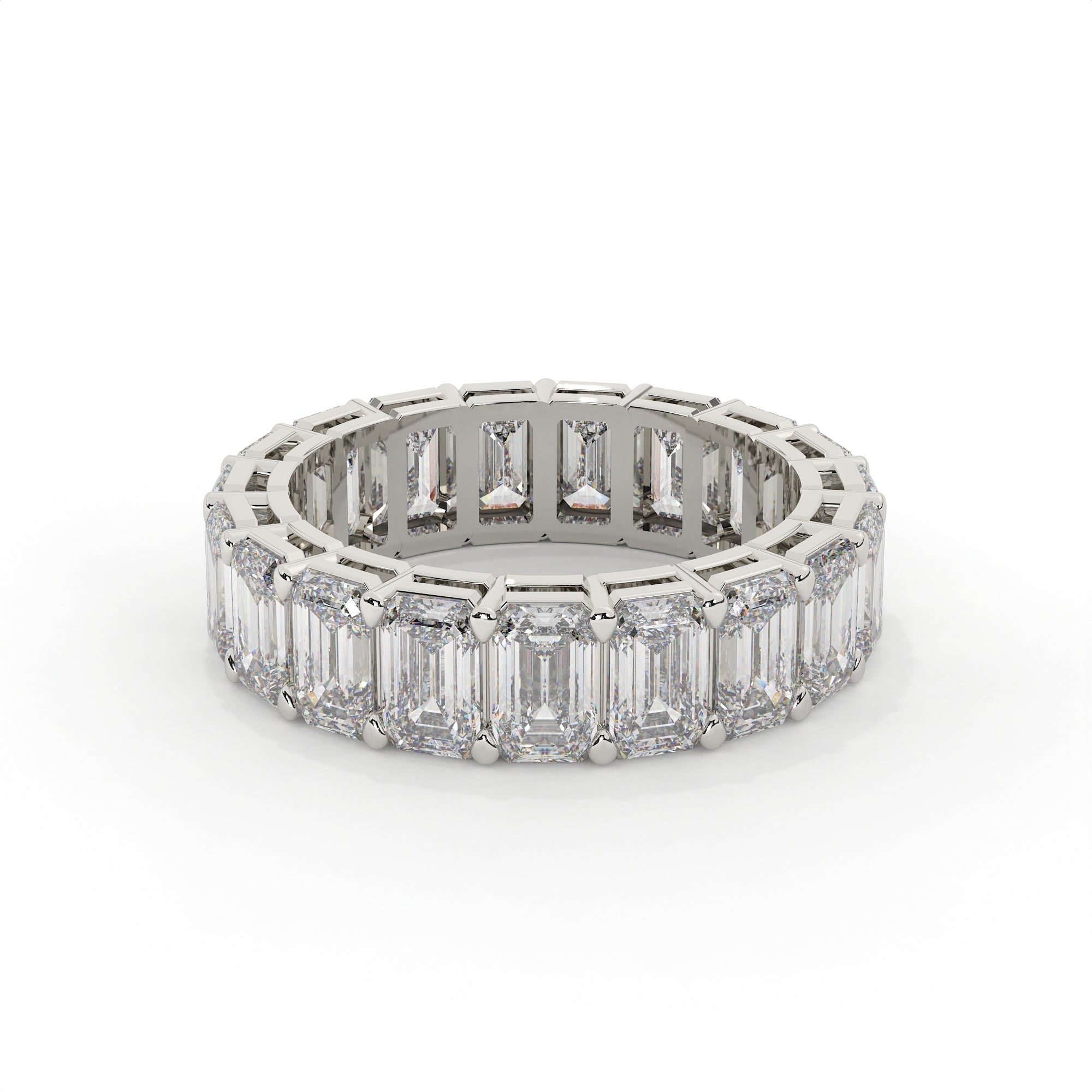 Diamond ring with emerald-cut stones on a white background
