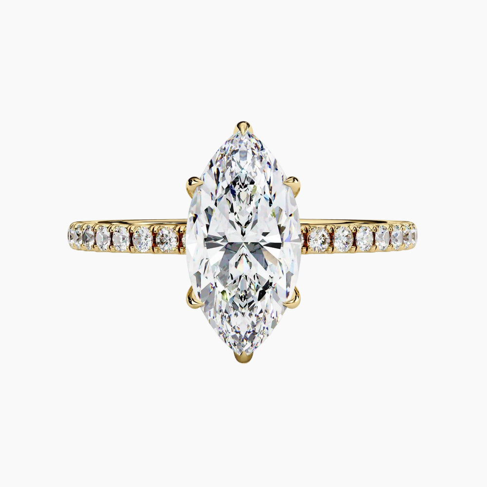 Gold ring with a large marquise-shaped diamond and smaller diamonds on the band against a white background