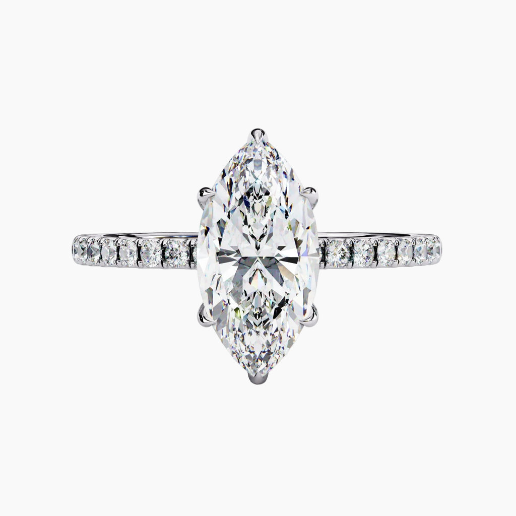 Diamond ring with a pear-shaped center stone on a white background