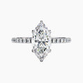 Diamond ring with a pear-shaped center stone on a white background