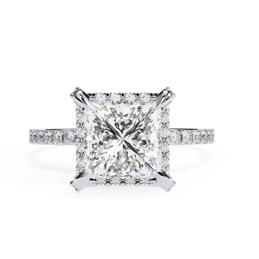 Diamond ring with a large central gemstone and smaller stones on the band against a white background