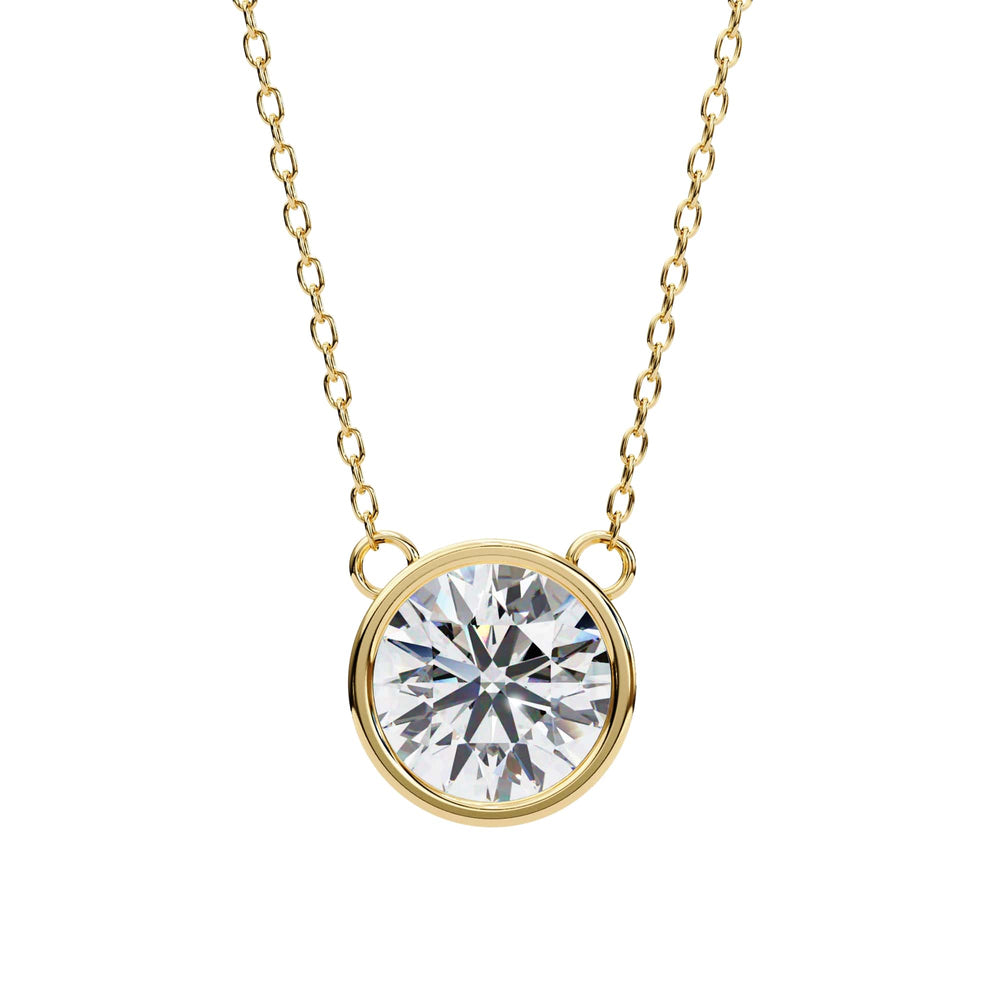 Gold necklace with a round diamond pendant on a white background