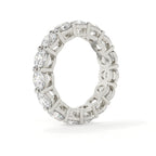 Diamond ring with a white gold band on a white background