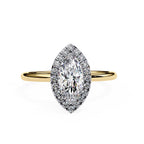 Gold ring with a marquise-shaped diamond on a white background