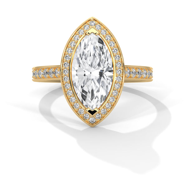 Gold ring with a large diamond and smaller diamonds on the band against a white background