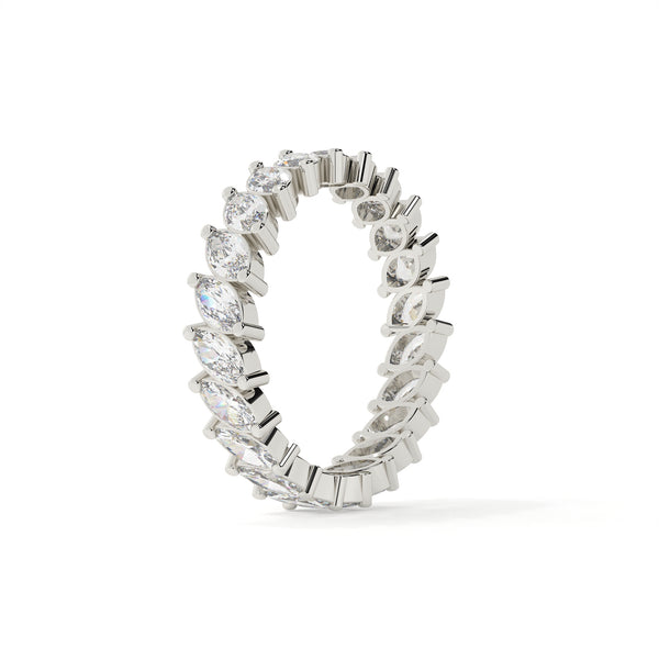 Silver ring with diamond accents on a white background