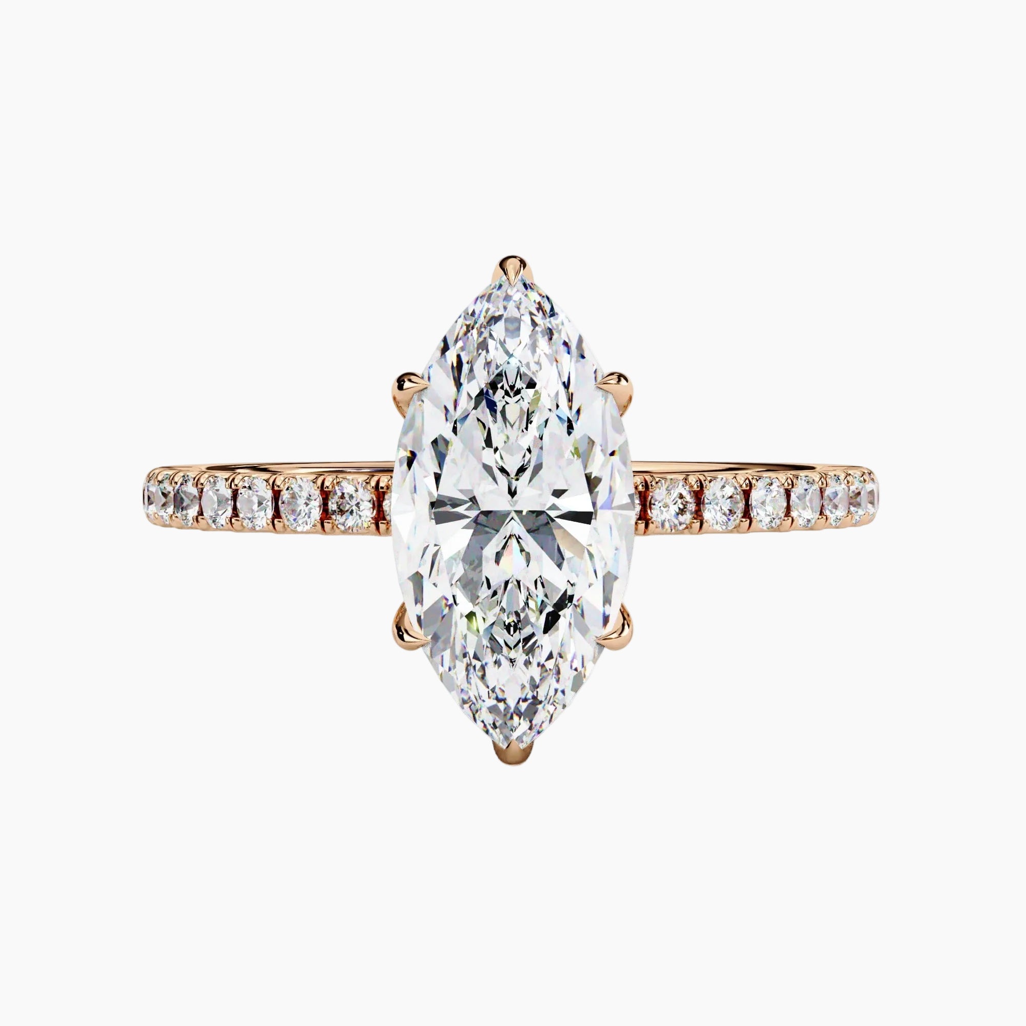 Diamond ring with a pear-shaped center stone on a white background
