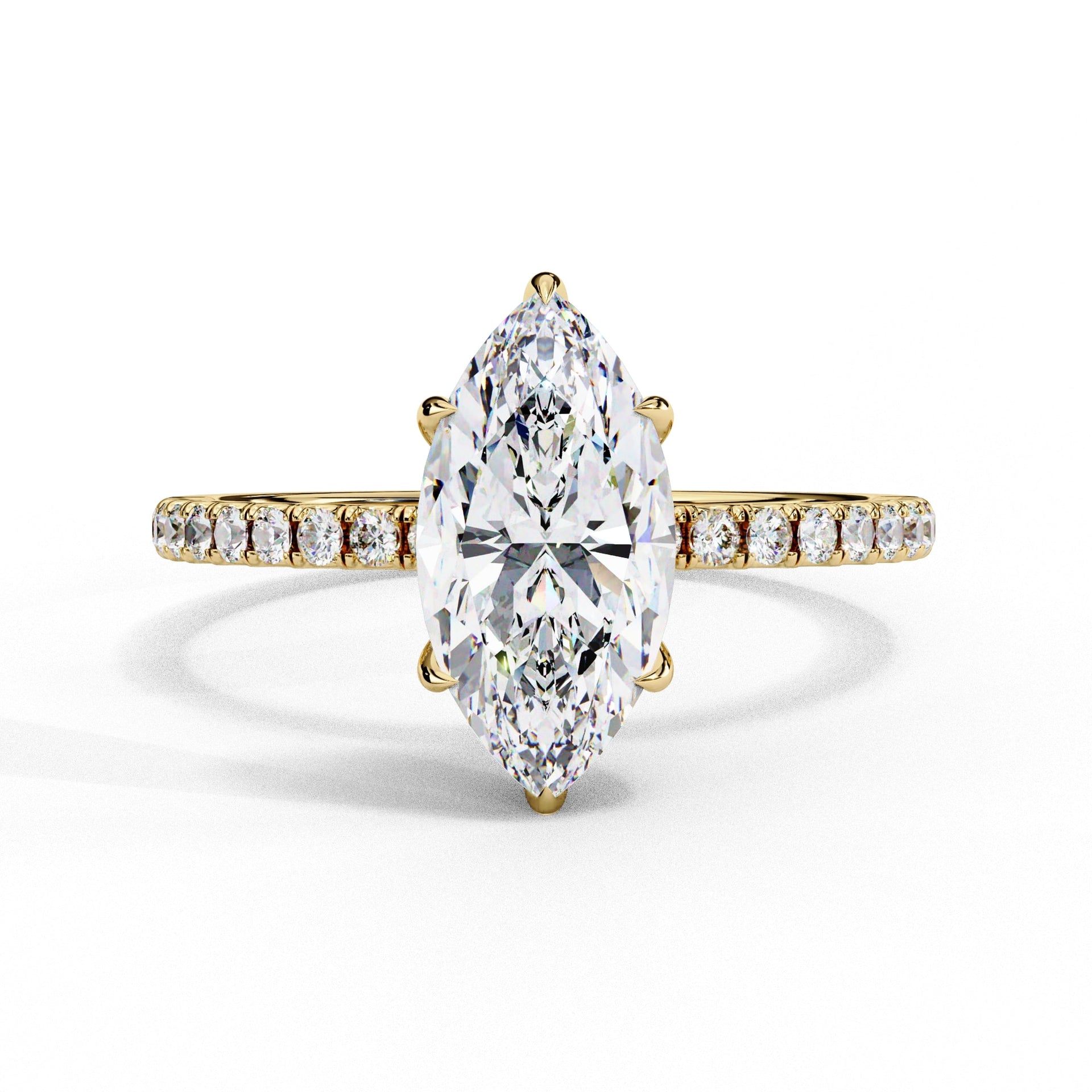 Gold ring with a large marquise-shaped diamond and smaller diamonds on the band against a white background
