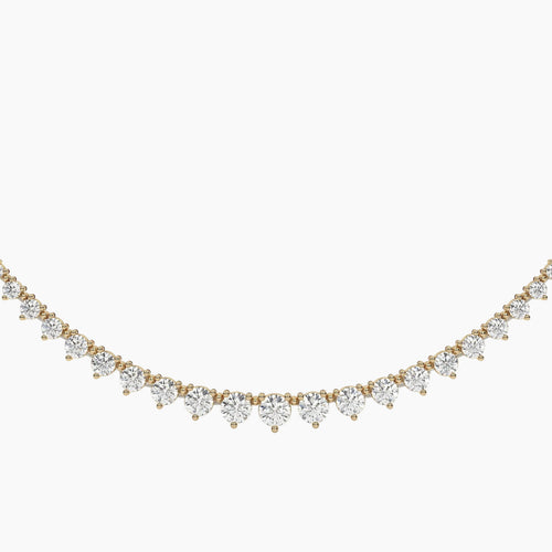 Gold and diamond necklace on a white background