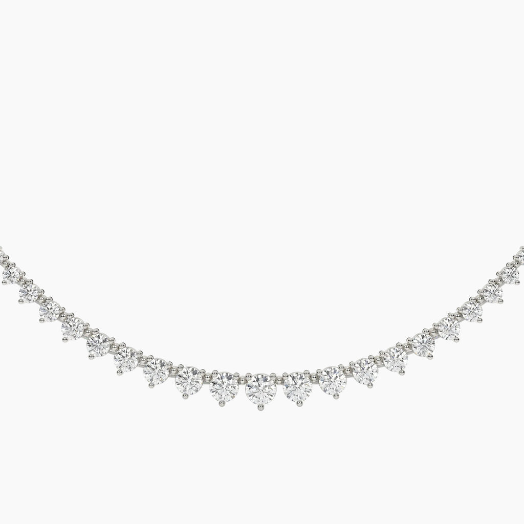 Delicate silver necklace with small diamonds on a white background