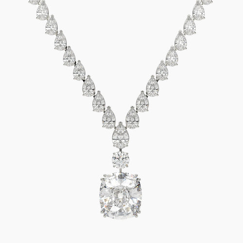 Diamond necklace with a large central gemstone and smaller stones on a white background