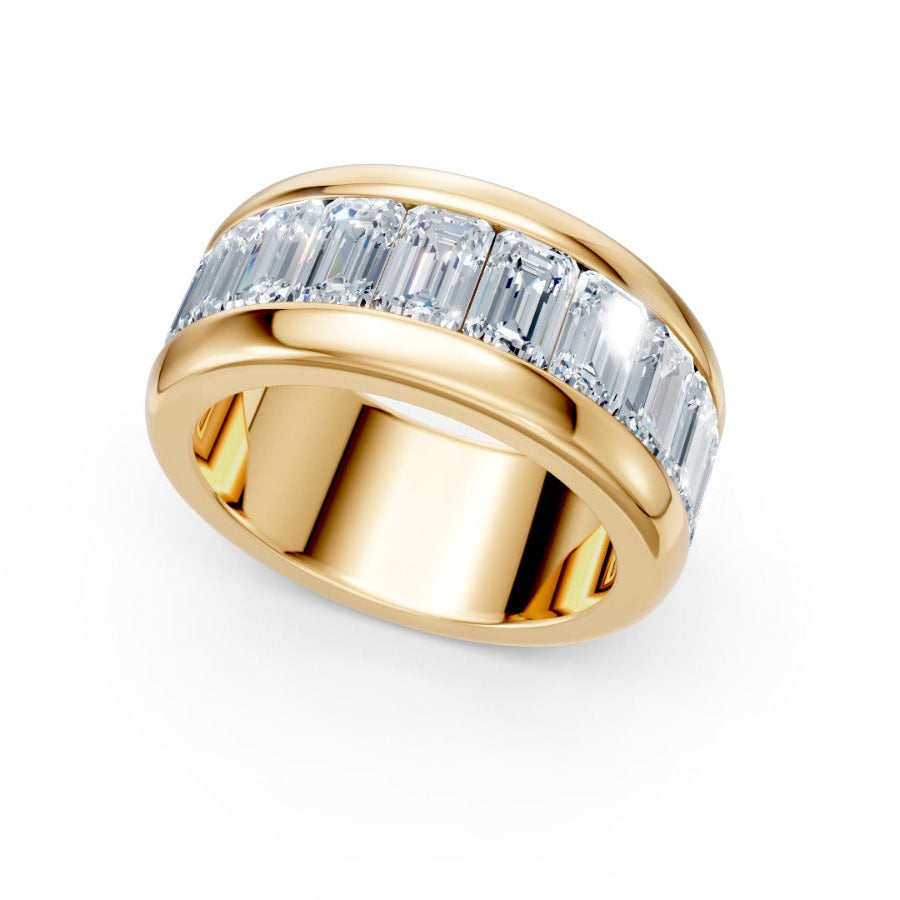 Gold ring with diamond accents on a white background