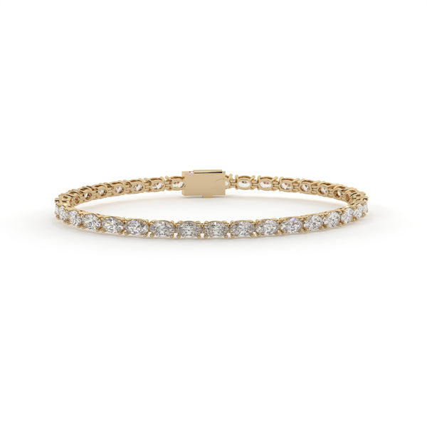 Gold bracelet with diamond accents on a white background