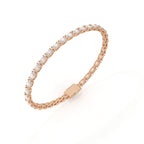 Rose gold bracelet with diamond accents on a white background