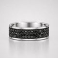 Multiple round cut black diamond men's eternity pavé ring featuring rows of black diamonds set in a polished white gold band.