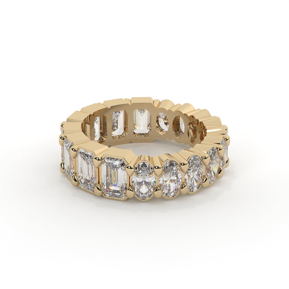 Gold ring with diamond stones on a white background