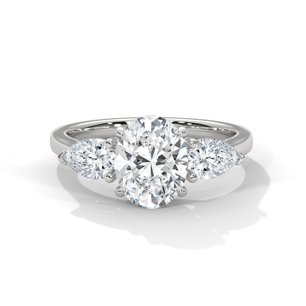 Diamond ring with a heart-shaped center stone on a white background