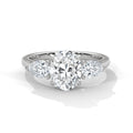 Diamond ring with a heart-shaped center stone on a white background