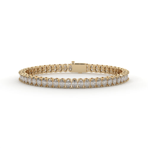 Gold bracelet with diamonds on a white background