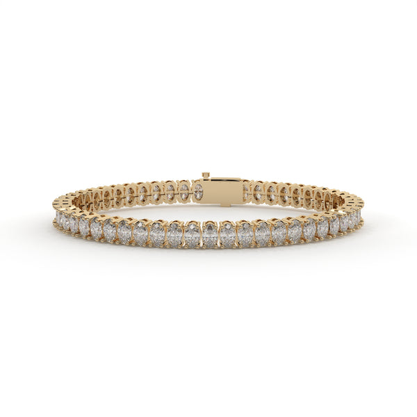 Gold bracelet with diamonds on a white background
