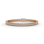 Rose gold bracelet with diamonds on a white background