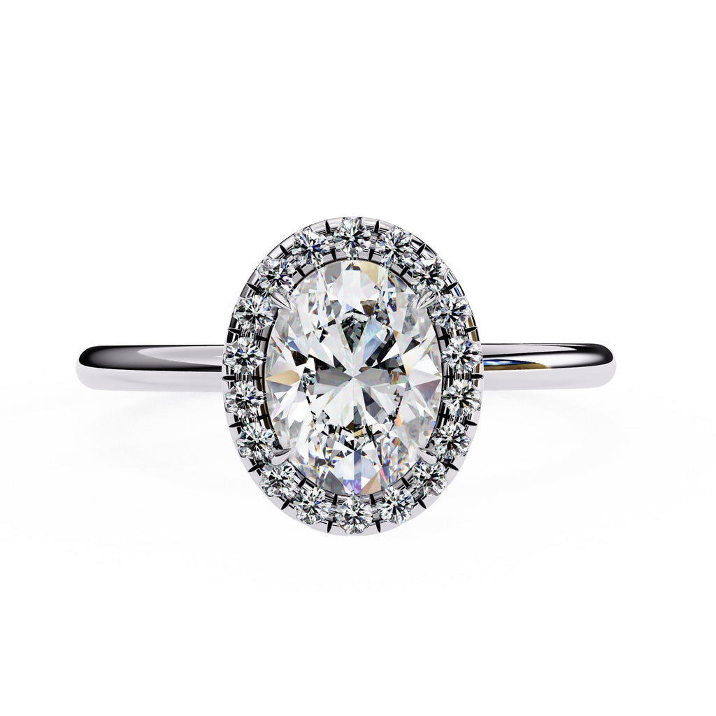 Diamond ring with a halo on a white background