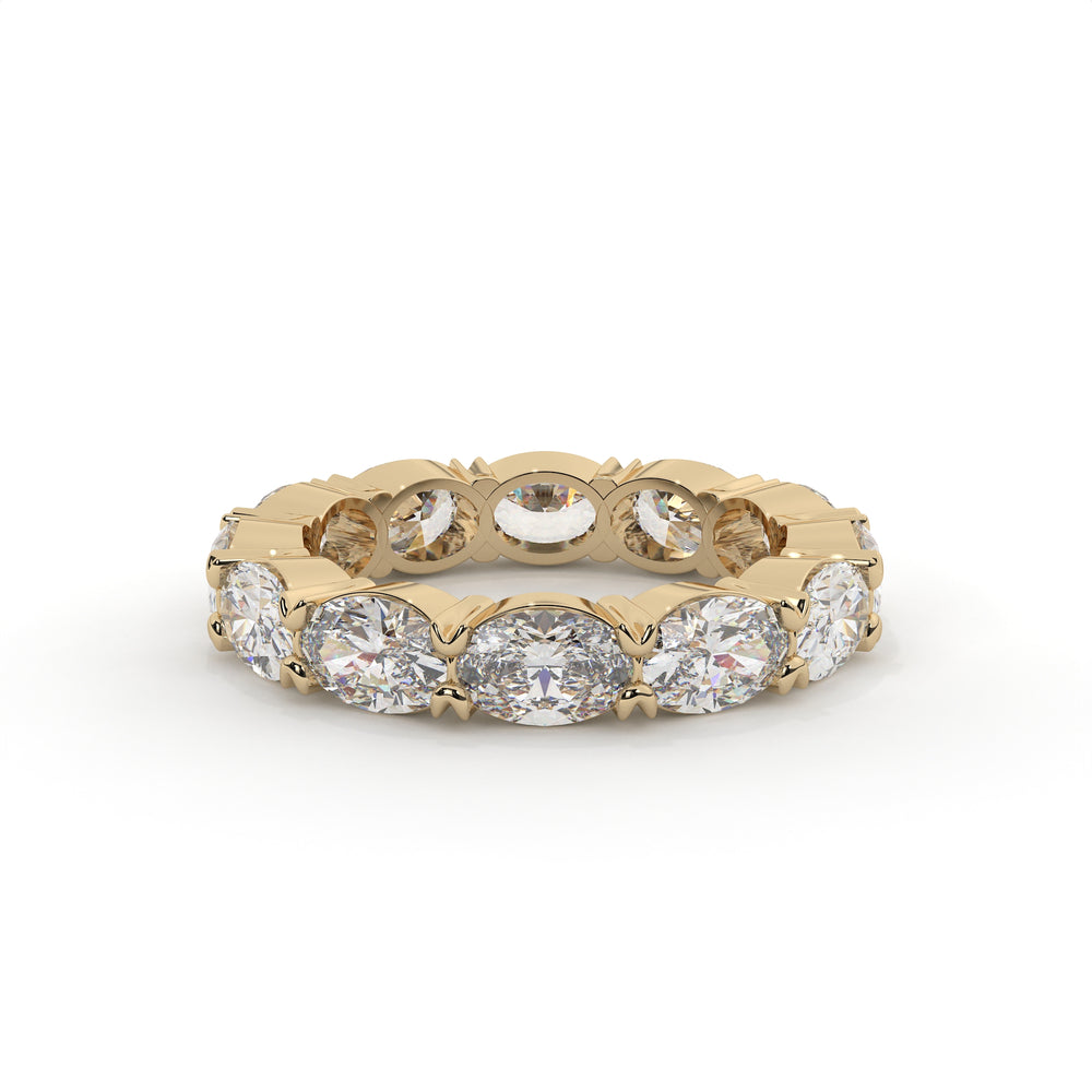 Gold ring with embedded diamonds on a white background