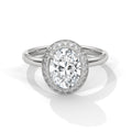 Diamond ring with a halo on a white background