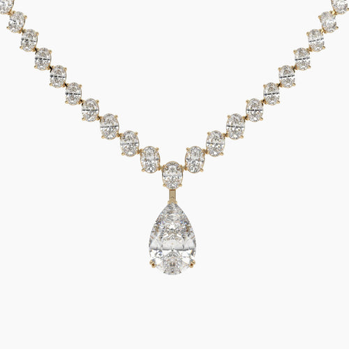 Diamond necklace with a teardrop pendant on a white background