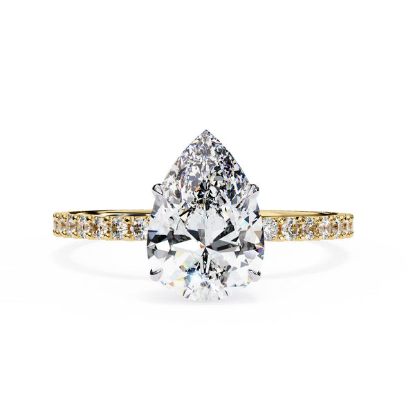 Diamond ring with pear-shaped center stone on a white background