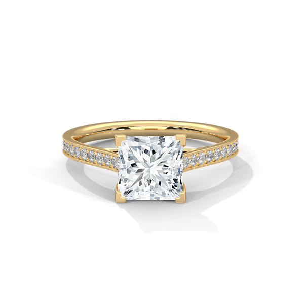 Gold ring with a large diamond and smaller diamonds on the band against a white background