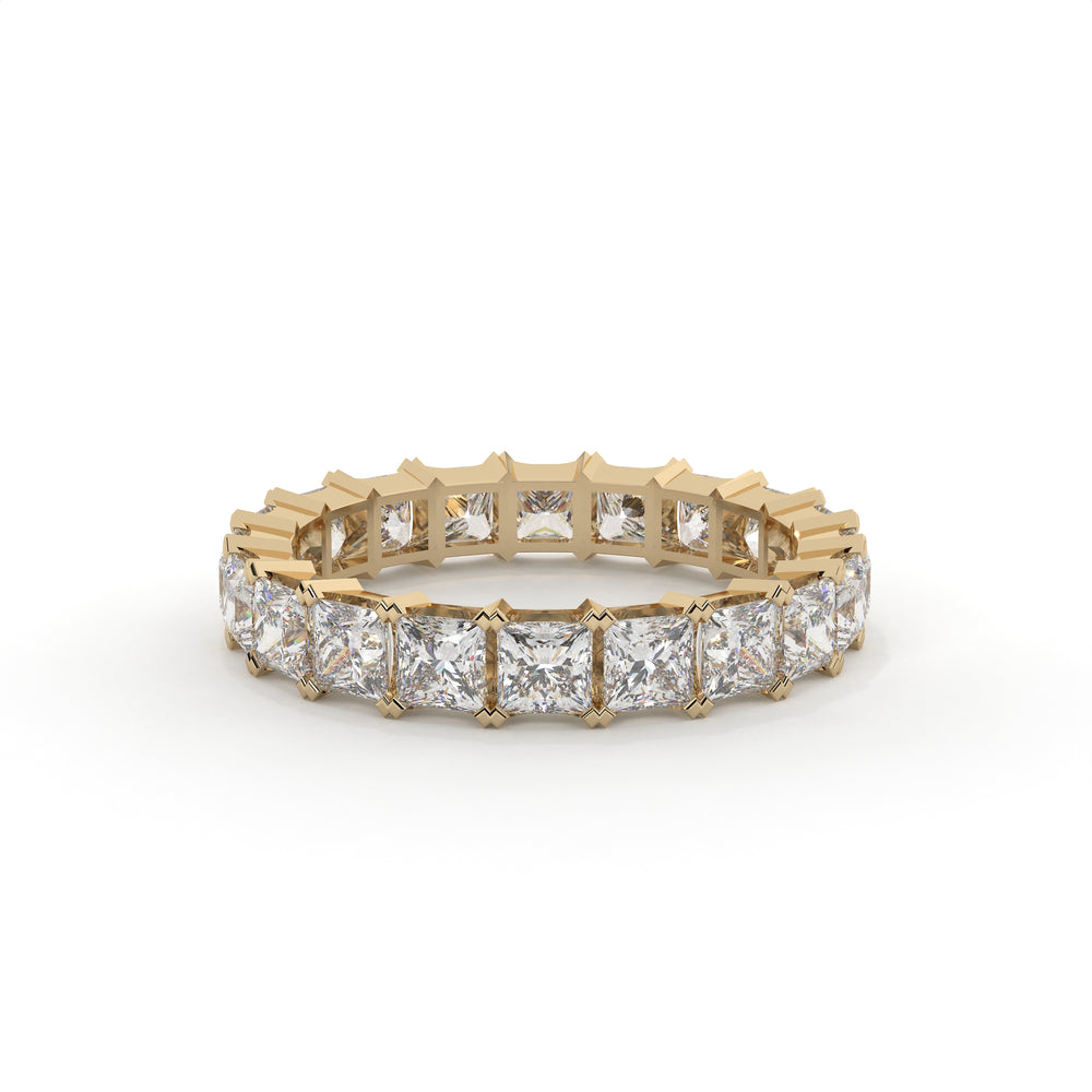 Gold ring with diamond stones on a white background