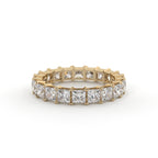 Gold ring with diamond stones on a white background