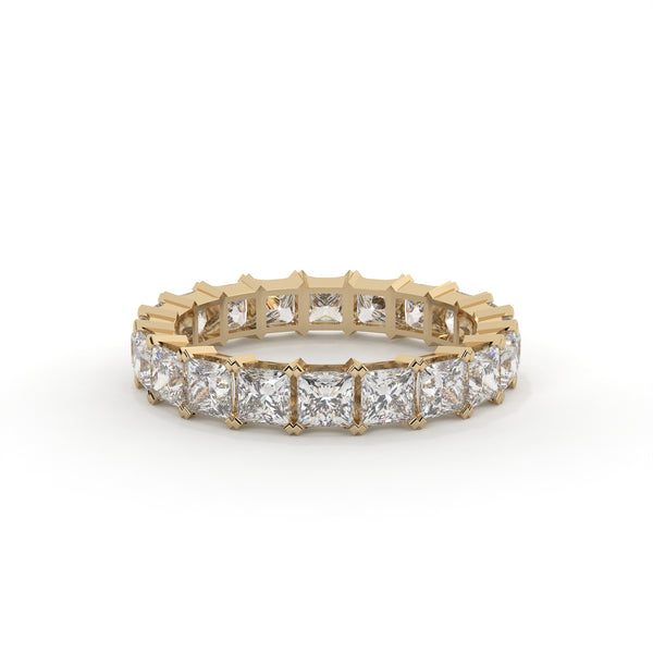 Gold ring with diamond stones on a white background