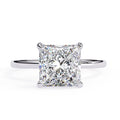 Diamond ring with a square-cut gemstone on a white background
