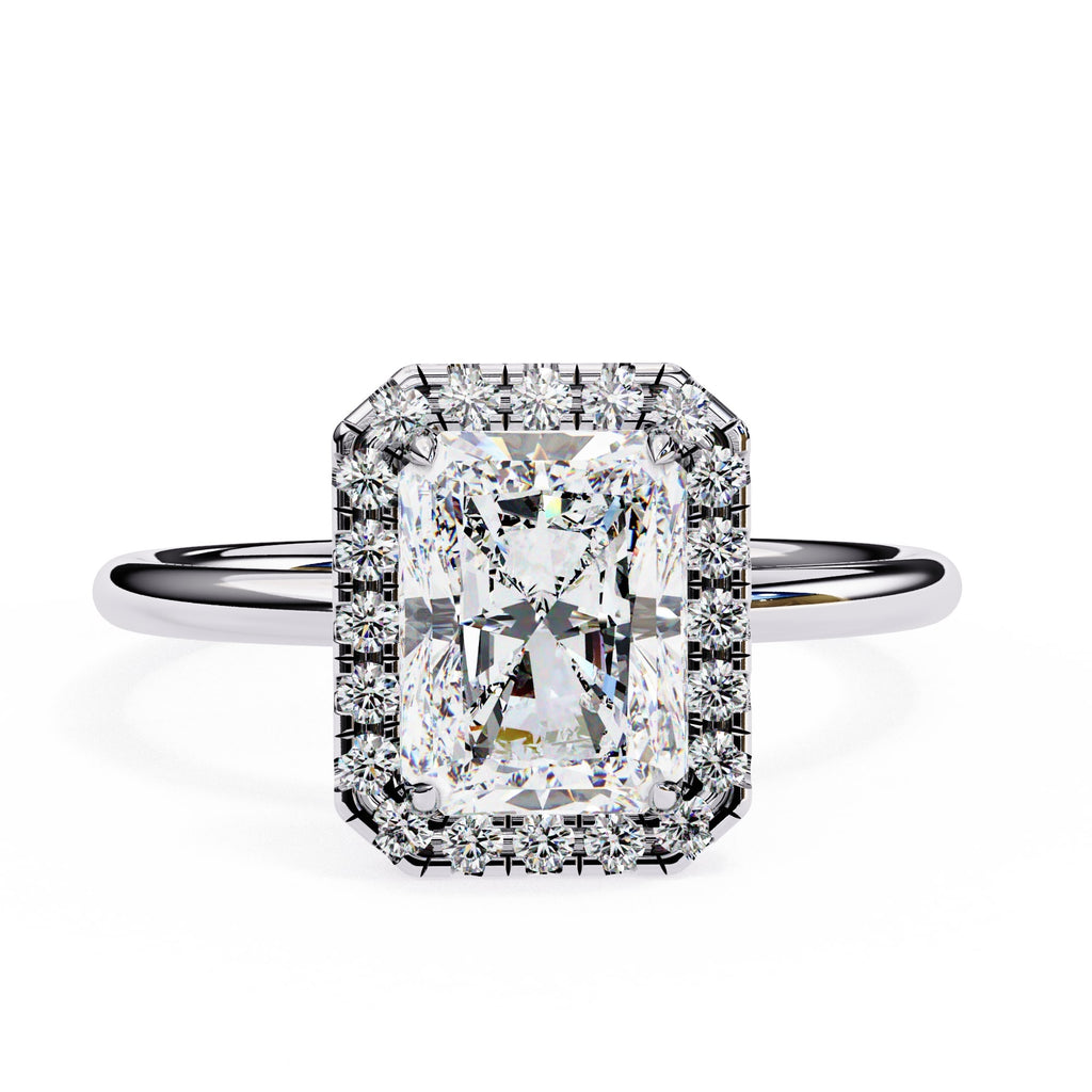 Diamond ring with a rectangular cut gemstone on a white background