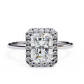 Diamond ring with a rectangular cut gemstone on a white background