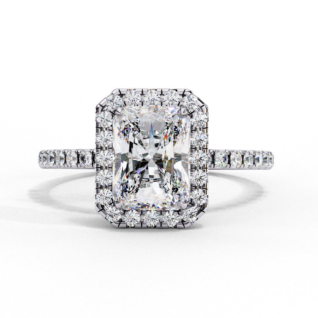 Diamond ring with a large central gemstone and smaller stones on a white background