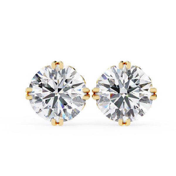Pair of diamond stud earrings on a white background