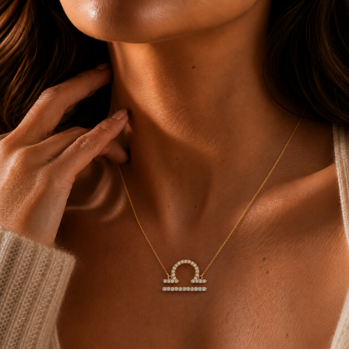 Necklace with a Libra pendant worn by a person