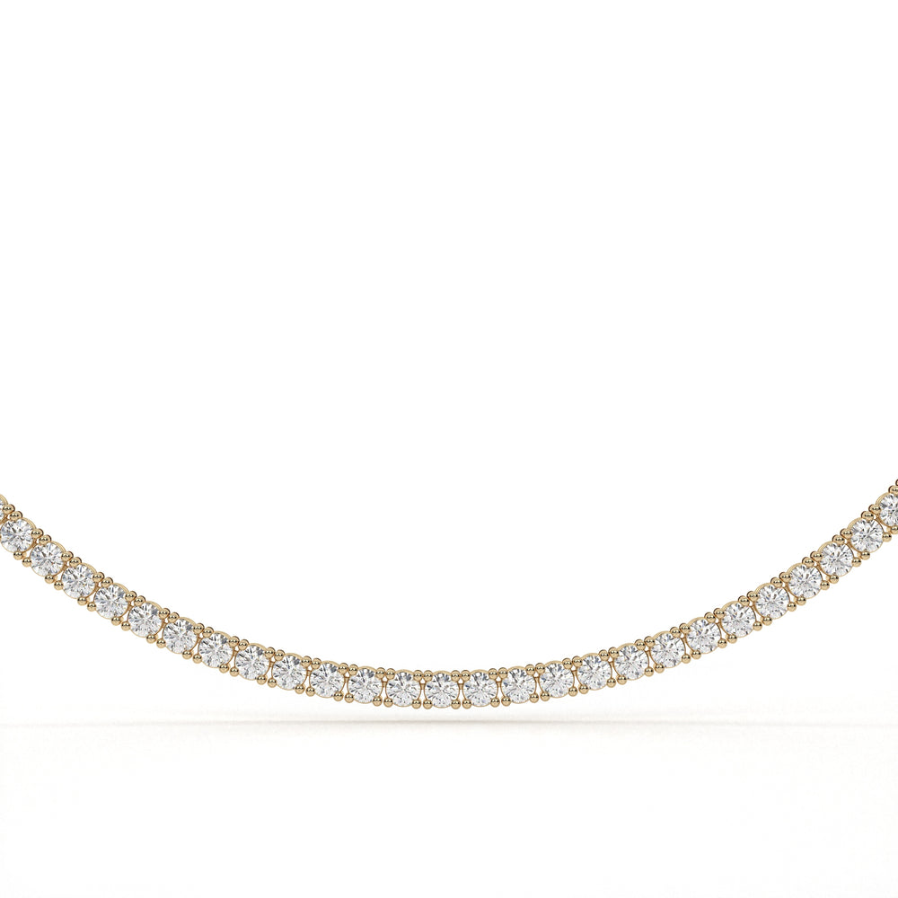 Gold necklace with diamonds on a white background
